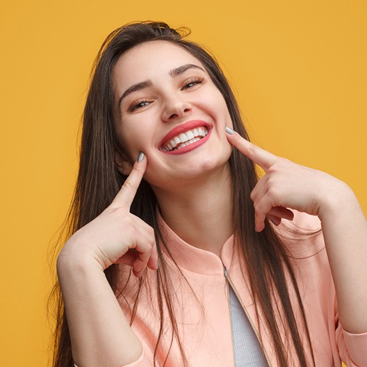 Woman with a healthy smile from Aetna dentist in Arlington.