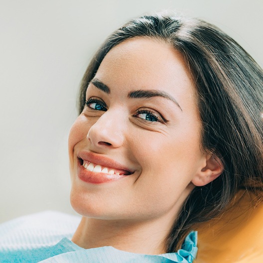 Woman at dentist using her dental insurance in Arlington.