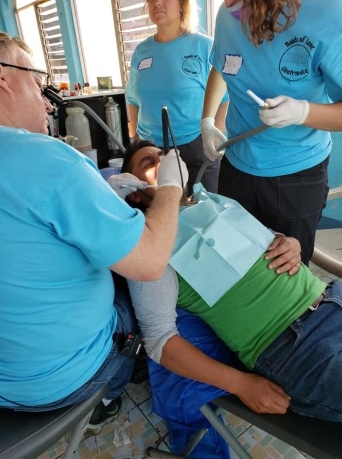 Group of dental team members caring for dental patient