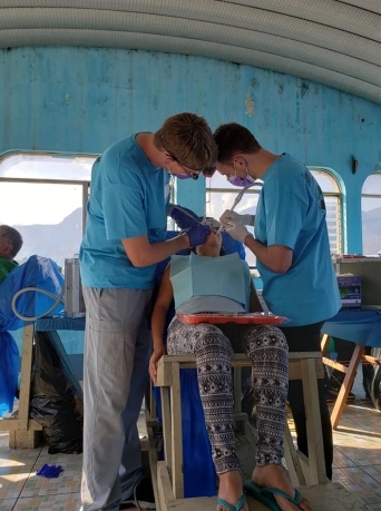 Patient receiving dental treatment at community event