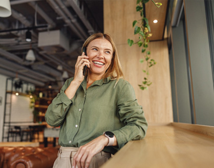 Woman smiling while talking on phone