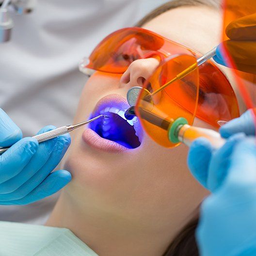 Patient receiving cosmetic dental bonding treatment