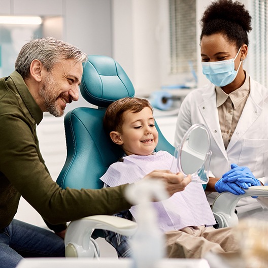 a father and son vising their family dentist in Arlington