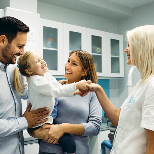 a family visiting their dentist in Arlington