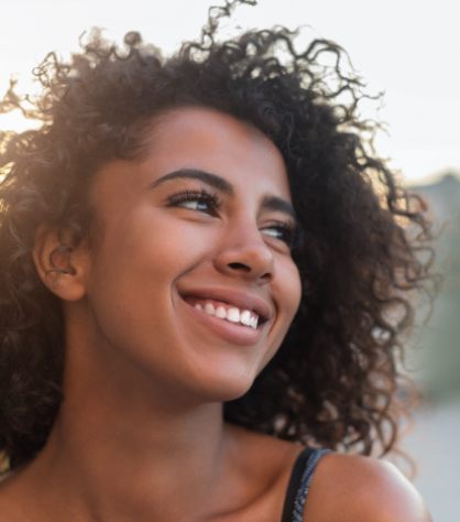 Woman sharing smile after preventive dentistry