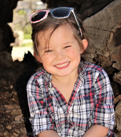 Little girl with healthy smile after children's dentistry