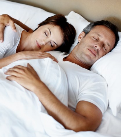 Man and woman sleeping soundly thanks to sleep apnea treatment