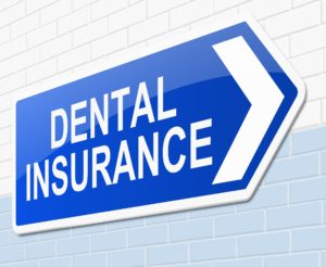 Dental insurance sign on a wall.