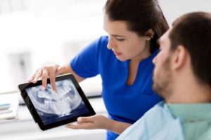 Patient viewing an X-ray with their dentist