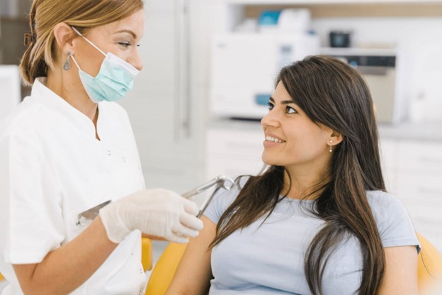 patient speaking with dentist about dental crown lifespan