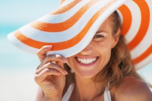 a woman with a beautiful smile enjoying her summer vacation